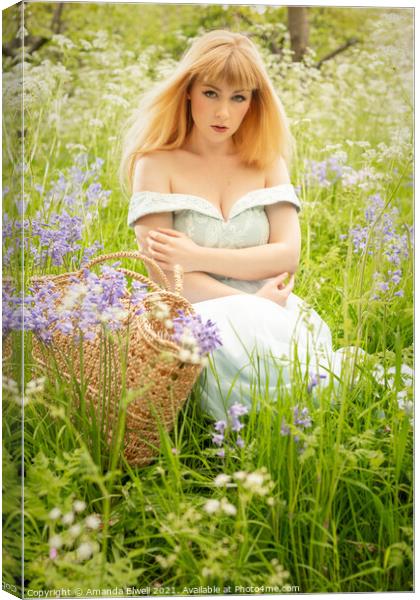 Woman Sitting In Spring Meadow Canvas Print by Amanda Elwell