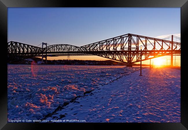 Sunset on the frozen St Lawrence river, Quebec Framed Print by Colin Woods
