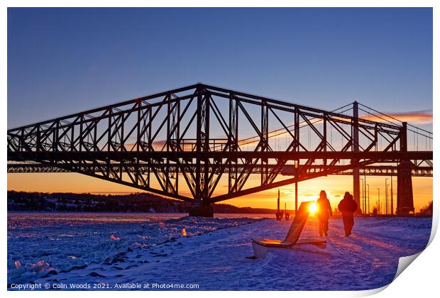 People going for an evening walk at sunset by the frozen St Lawrence River, Quebec, Canada Print by Colin Woods