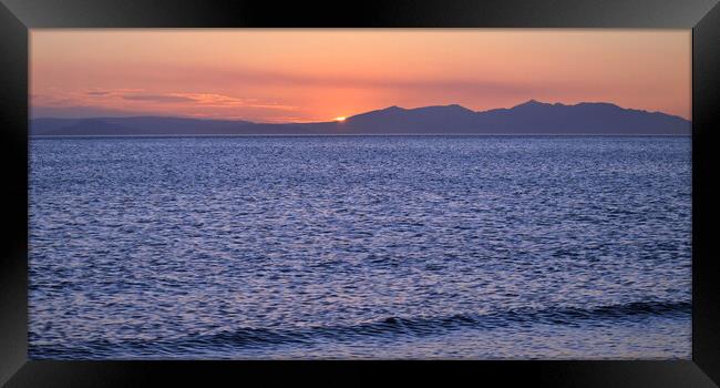 Arran and its mountains silhouetted by a setting s Framed Print by Allan Durward Photography