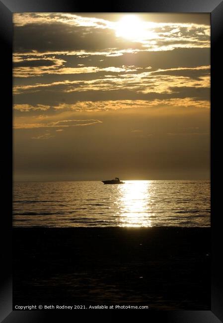 Boat at sunset Framed Print by Beth Rodney