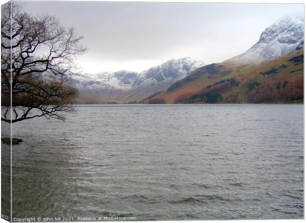 Buttermere Lake and haystack in the lake district Canvas Print by john hill
