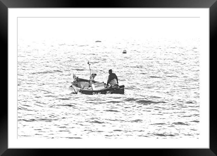 Silver light, St Ives fisherman in the sunlight. Framed Mounted Print by Ed Whiting