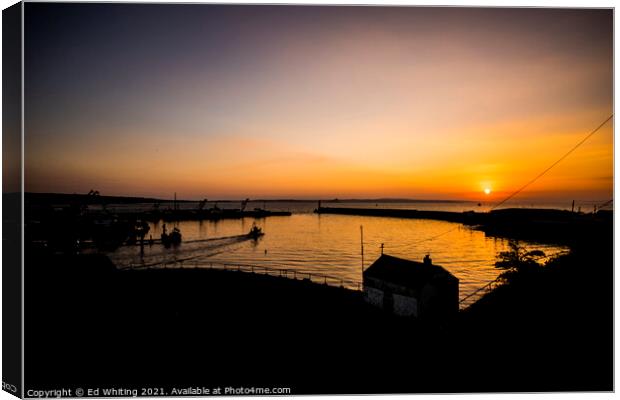 Sunrise at Newlyn Harbour as the first boat goes out. Canvas Print by Ed Whiting