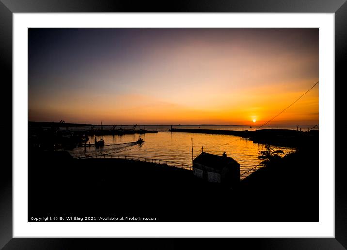 Sunrise at Newlyn Harbour as the first boat goes out. Framed Mounted Print by Ed Whiting