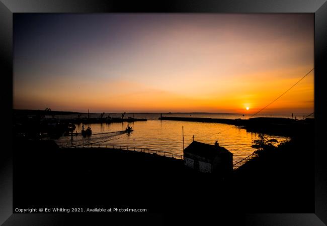 Sunrise at Newlyn Harbour as the first boat goes out. Framed Print by Ed Whiting