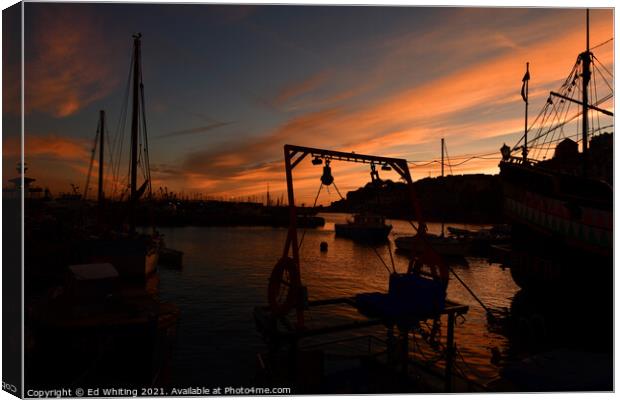 Brixham Harbour at sunset. Canvas Print by Ed Whiting