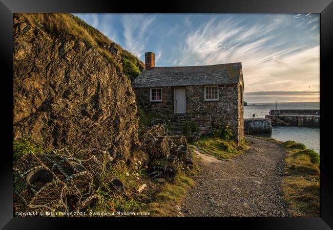 Lobster Pots and  the Old Net Loft, Mullion Cove Framed Print by Brian Pierce