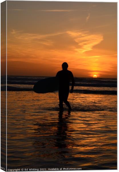 Surfer in a Cornish sunset. Canvas Print by Ed Whiting