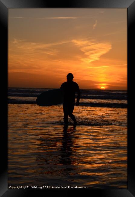 Surfer in a Cornish sunset. Framed Print by Ed Whiting