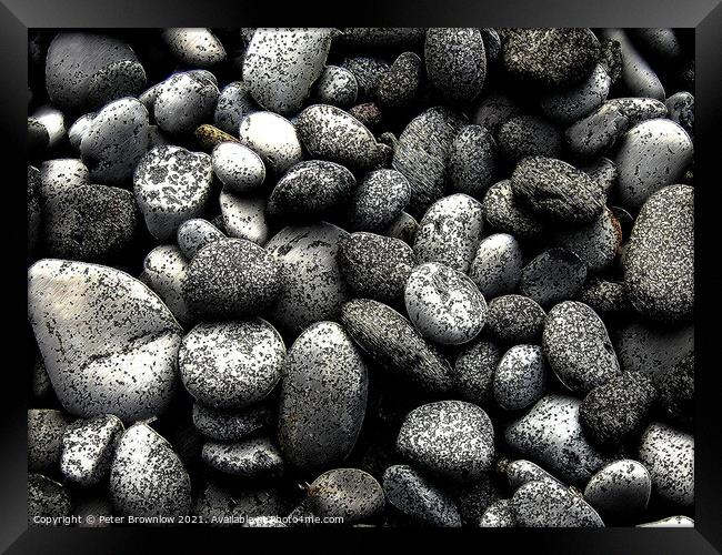 Abstract textured pebbles Framed Print by Peter Brownlow