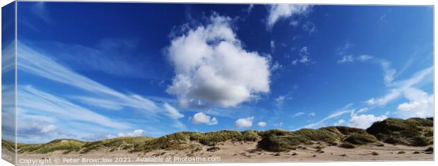 Blue sky over Harlech beach in North wales Canvas Print by Peter Brownlow