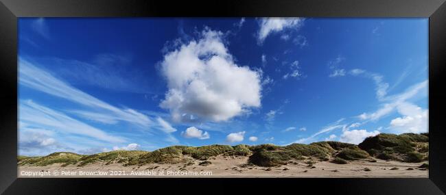 Blue sky over Harlech beach in North wales Framed Print by Peter Brownlow