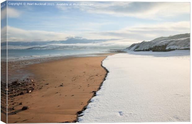 Benllech Beach with Snow Canvas Print by Pearl Bucknall
