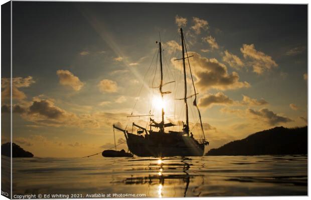 Yacht in sunset taken from the water in Philippines. Canvas Print by Ed Whiting