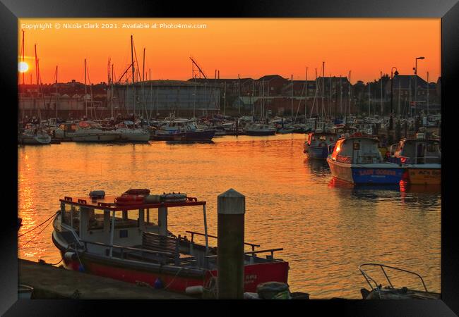 Majestic Sunset by the Marina Framed Print by Nicola Clark