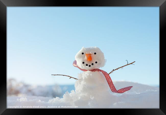Snowman In Landscape Framed Print by Amanda Elwell