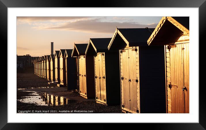 Sunkissed Freezing Beach huts. Framed Mounted Print by Mark Ward