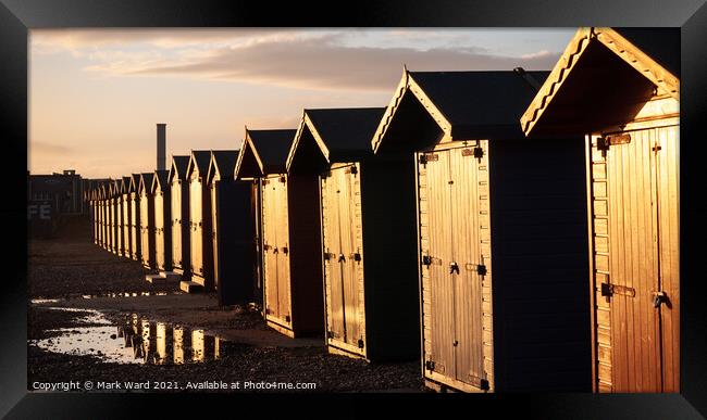Sunkissed Freezing Beach huts. Framed Print by Mark Ward