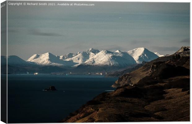 Snow covered Red Cuillin Hills beyond the Sound of Raasay. Canvas Print by Richard Smith