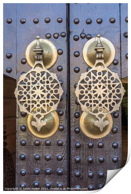 Ornate brass doorknockers Print by Kevin Hellon
