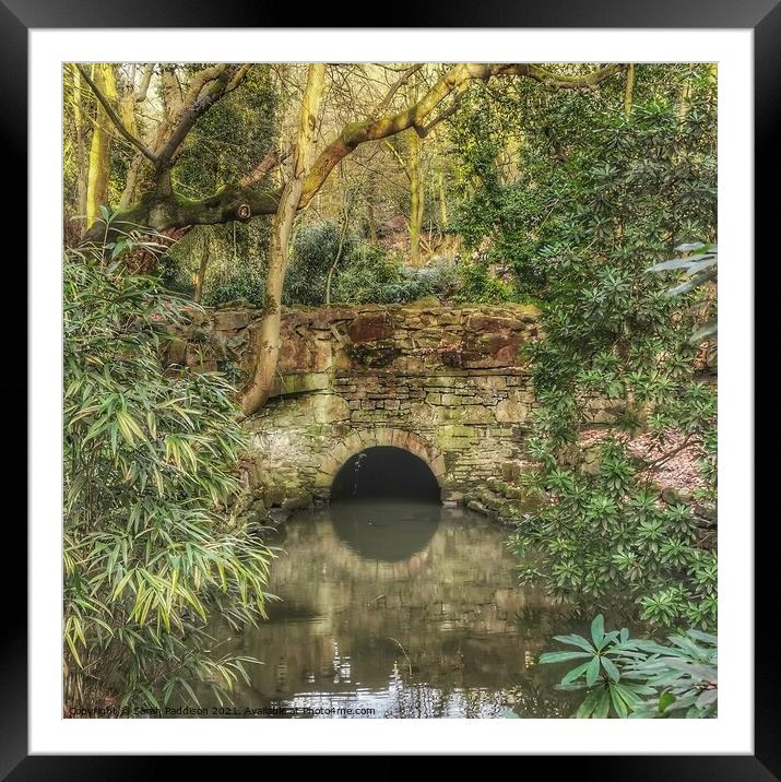 Reflection of a bridge in a calm stream Cheethams Park Stalybridge Framed Mounted Print by Sarah Paddison