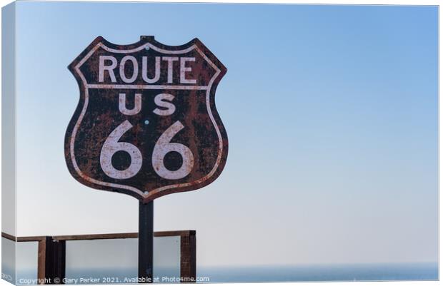 Route 66 sign, set against a clear blue sky Canvas Print by Gary Parker