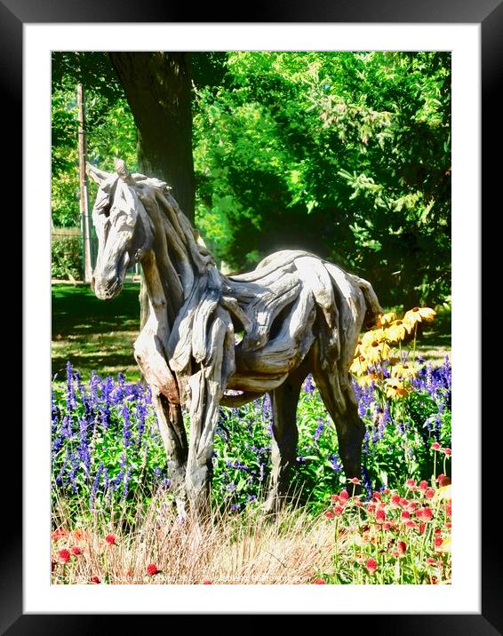 A wooden horse standing in flowers Framed Mounted Print by Stephanie Moore