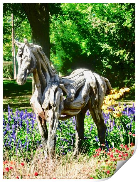 A wooden horse standing in flowers Print by Stephanie Moore