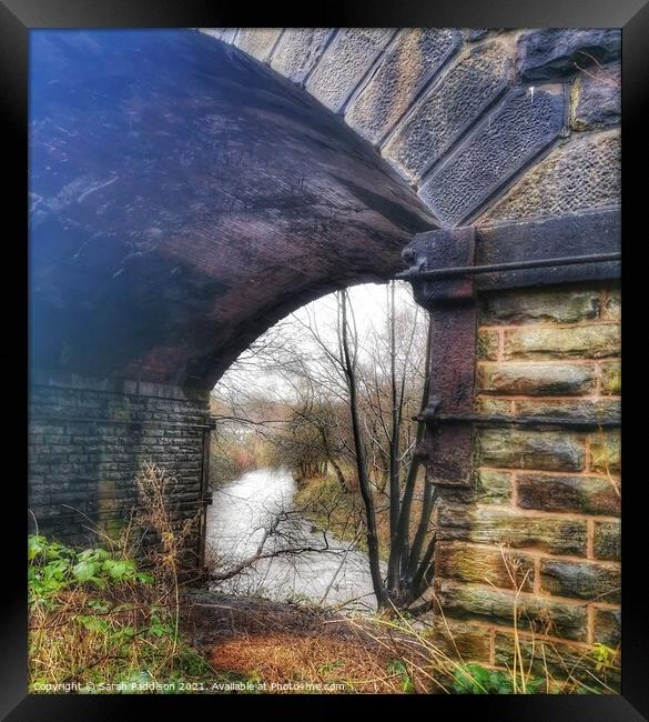View through the bridge to the river Tame - Ashton under Lyne Framed Print by Sarah Paddison