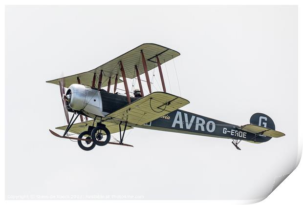 Avro 504K flies past in a cloudy sky Print by Steve de Roeck