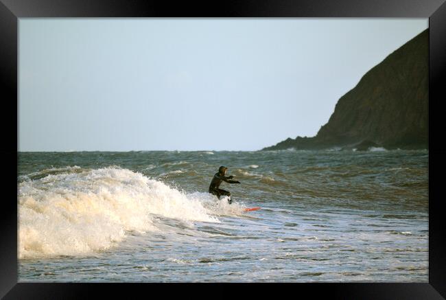 Surfing at Lynmouth Framed Print by graham young