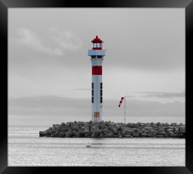 Lighthouse at Cannes with monochrome background Framed Print by Ann Biddlecombe