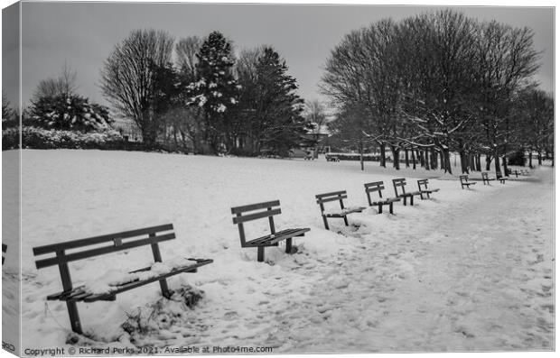 Seats in the snow Canvas Print by Richard Perks