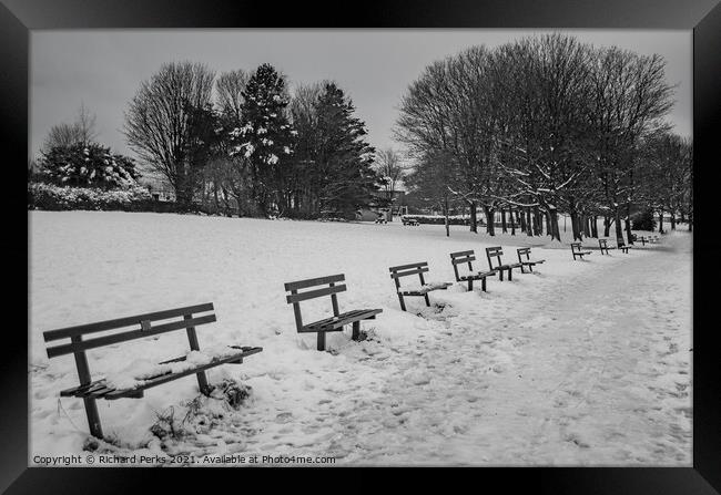Seats in the snow Framed Print by Richard Perks
