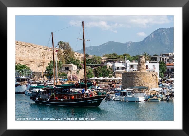 Gullet arriving at Kyrenia harbour Northern Cyprus Framed Mounted Print by Angus McComiskey