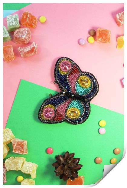 butterfly on colored paper with multicolored sweets Print by Andrei Babchanok