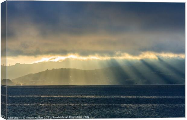 Sun rays and rainstorms on the Otago Peninsular Canvas Print by Kevin Hellon