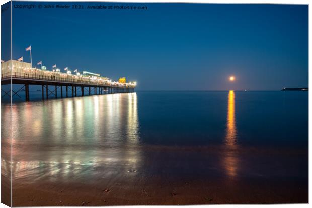 Paignton Pier By Moonlight Canvas Print by John Fowler