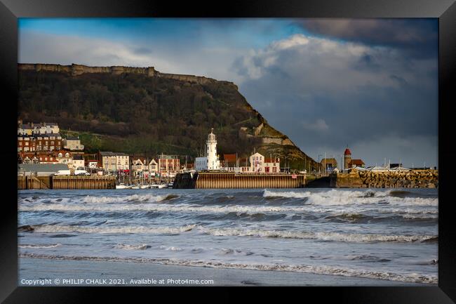 Scarborough lighthouse and sea front  233 Framed Print by PHILIP CHALK