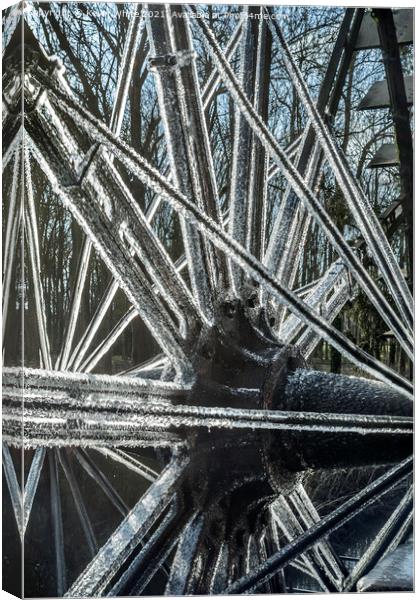 frozen ice on water wheel Canvas Print by Kevin White
