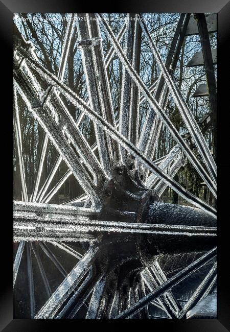frozen ice on water wheel Framed Print by Kevin White