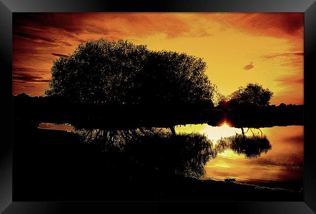 Sunset Reflections Framed Print by Louise Godwin