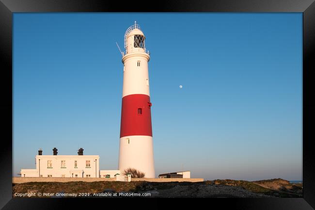 The Moon Behind The Iconic Lighthouse At Portland Bill, Dorset At Sunset Framed Print by Peter Greenway