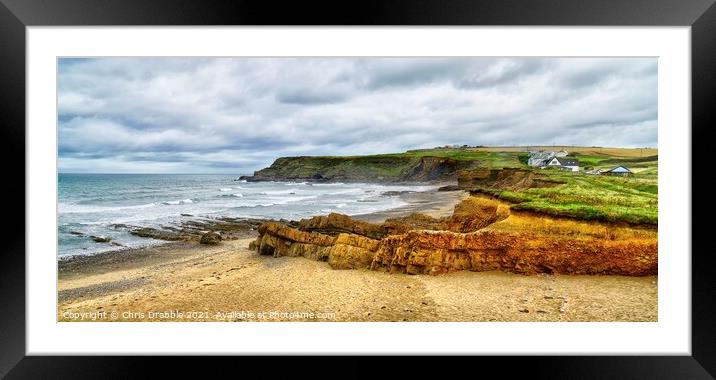 Widemouth Bay under cloudy skies Framed Mounted Print by Chris Drabble
