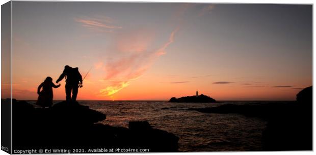Fisherman in Godrevy lighthouse sunset Canvas Print by Ed Whiting