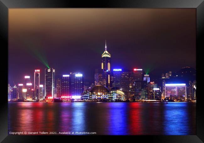 Hong Kong Island, Victoria Harbour waterfront including Hong Kong Convention and Exhibition Centre, and Central Plaza during A Symphony of Lights display. Framed Print by Geraint Tellem ARPS