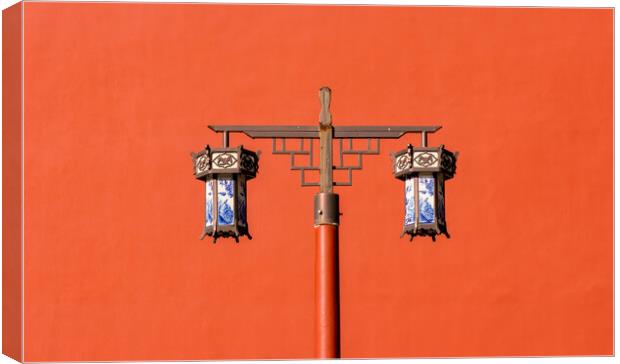 Old traditional porcelain lanterns in front of a red wall in Beijing, China Canvas Print by Mirko Kuzmanovic