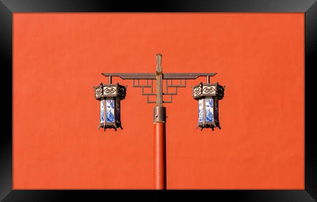 Old traditional porcelain lanterns in front of a red wall in Beijing, China Framed Print by Mirko Kuzmanovic