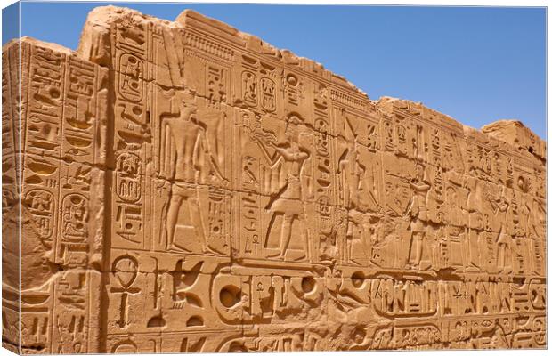 Relief details and Egyptian hieroglyphs at Karnak temple in Luxor, Egypt Canvas Print by Mirko Kuzmanovic
